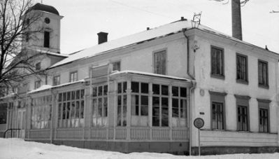Vintervy med en stor byggnad i förgrunden
Nyckelord: Söderköpings Brunn 