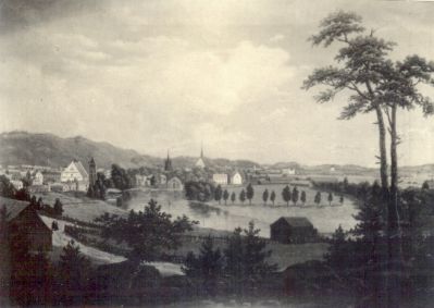 Foto av tavla med stadsvy
